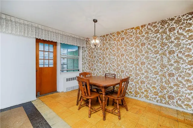 a view of a dining room with furniture and window