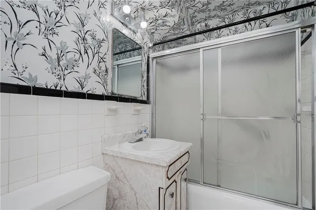 a bathroom with a sink and mirror