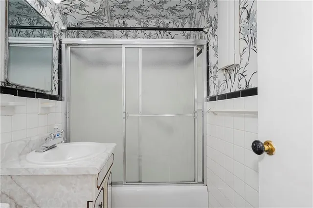 a bathroom with a sink and mirror