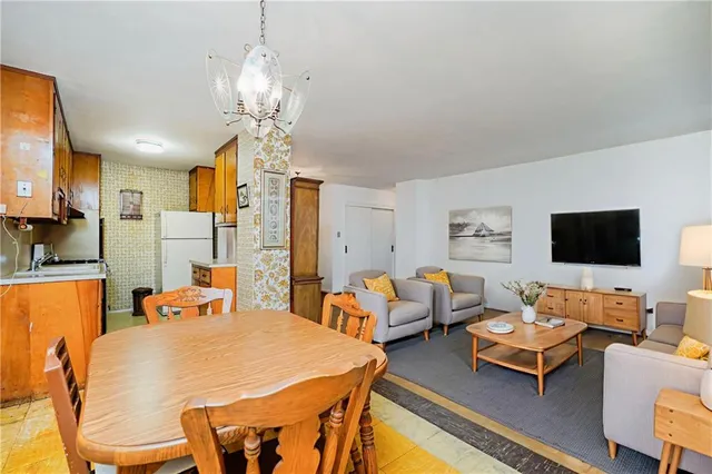 a bedroom with furniture and a chandelier