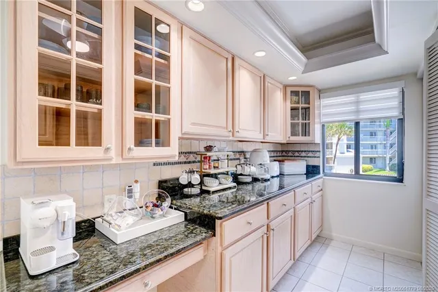a kitchen with stainless steel appliances granite countertop a sink and cabinets
