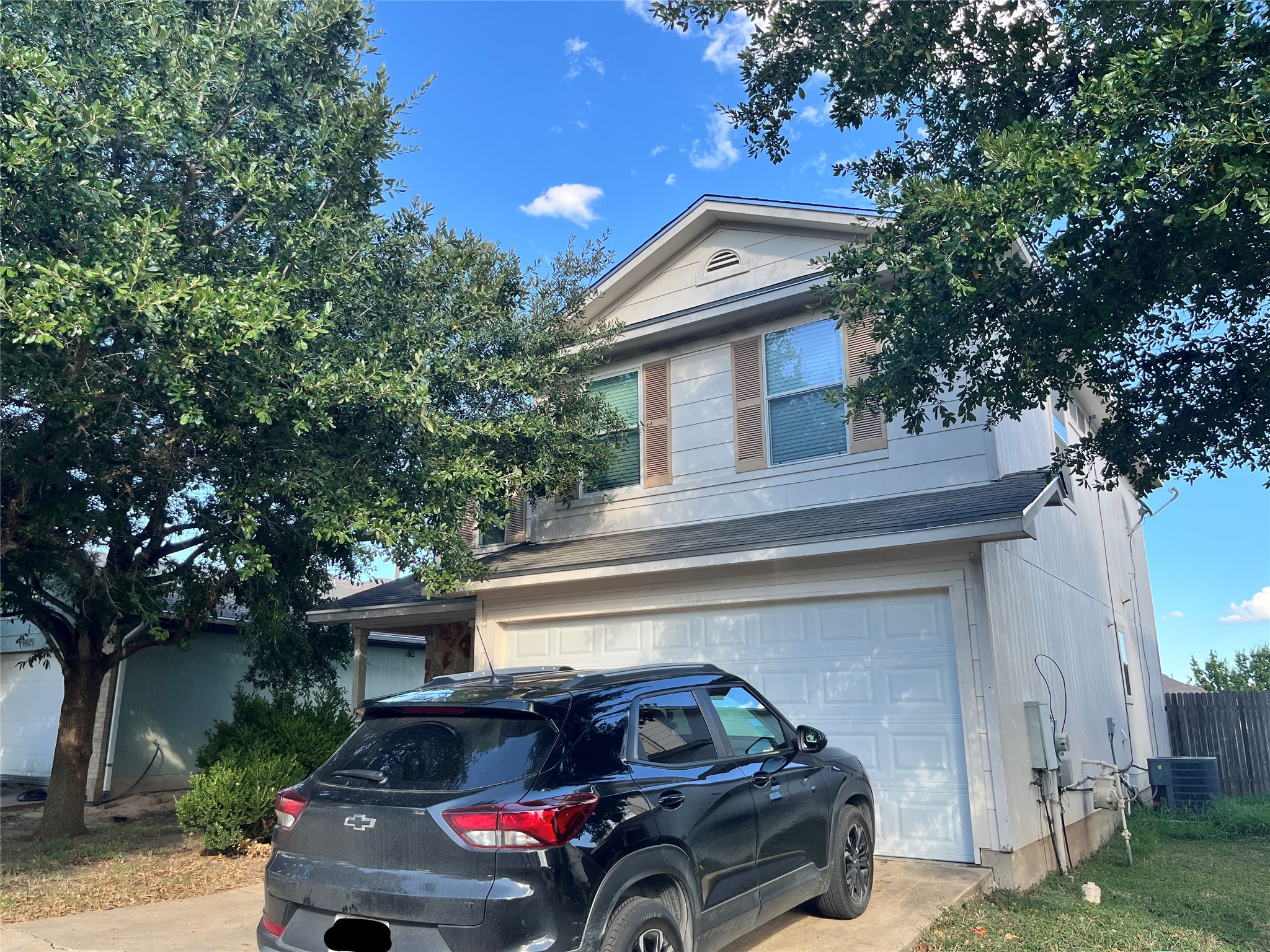 14413 Pebble Run Path Manor, TX 78653 - Photo 2 of 2 a car parked in front of a house