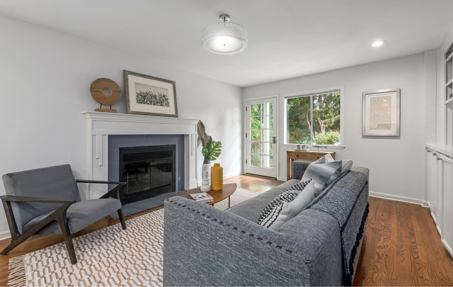 360 Iris Way Palo Alto, CA 94303 - Photo 13 of 28 a living room with furniture and a fireplace