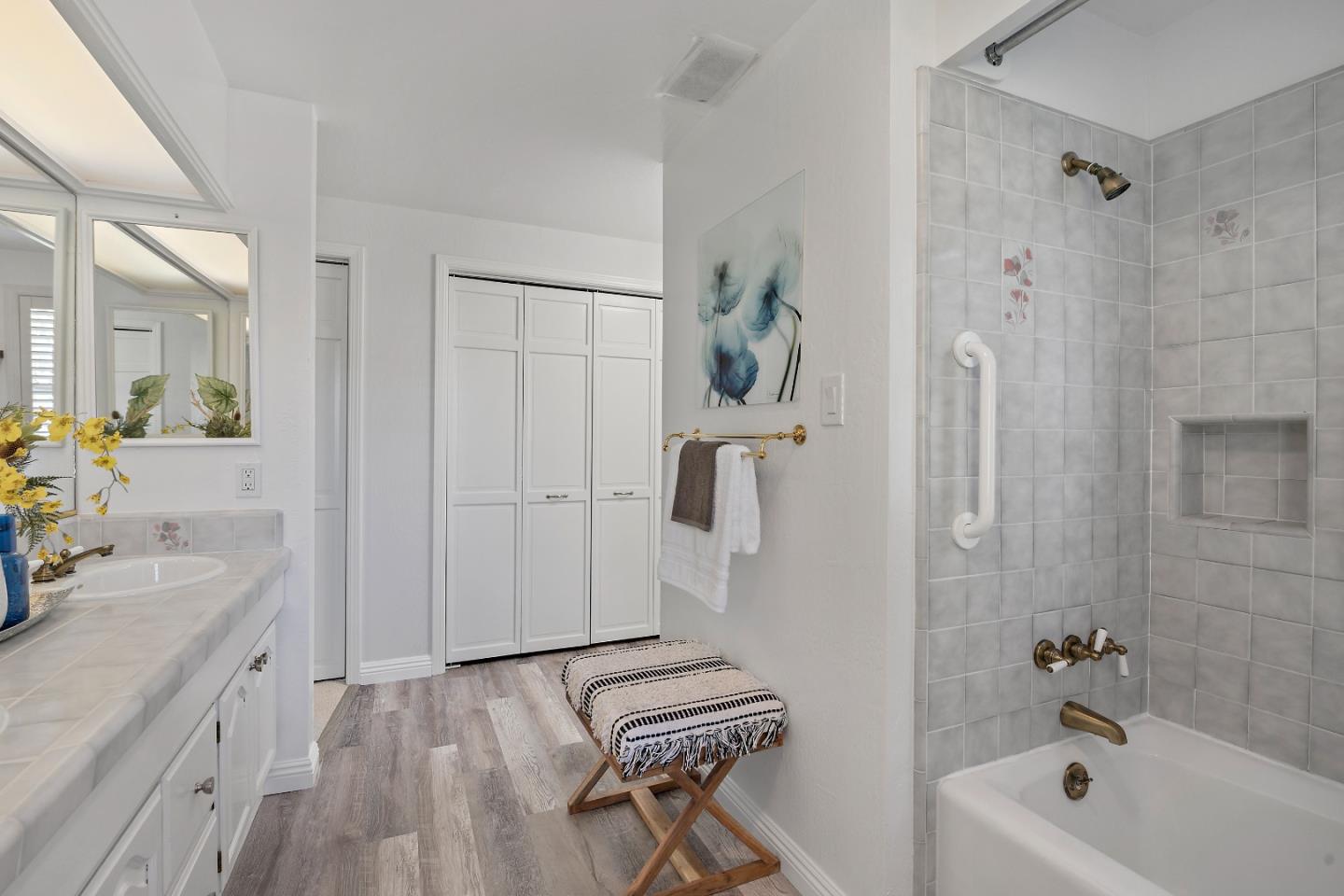 360 Iris Way Palo Alto, CA 94303 - Photo 24 of 28 a bathroom with a tub a sink and a shower