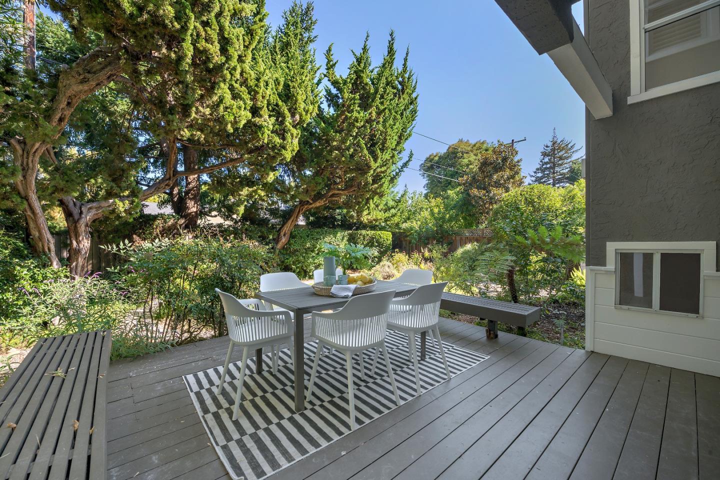 360 Iris Way Palo Alto, CA 94303 - Photo 25 of 28 a roof deck with table and chairs and potted plants
