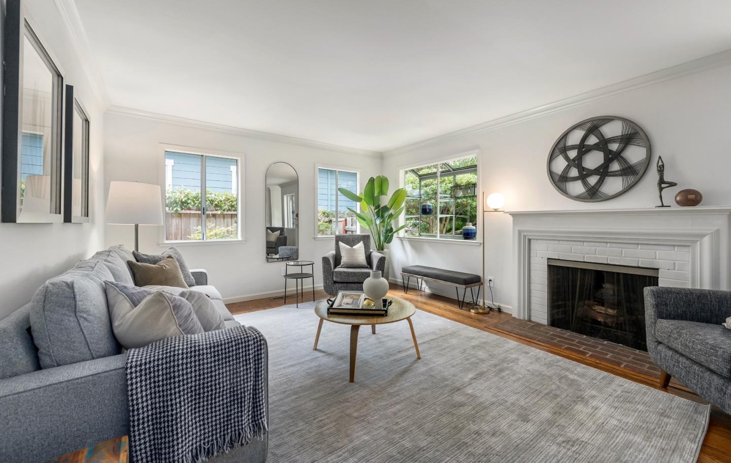 360 Iris Way Palo Alto, CA 94303 - Photo 5 of 28 a living room with furniture a fireplace and a large window