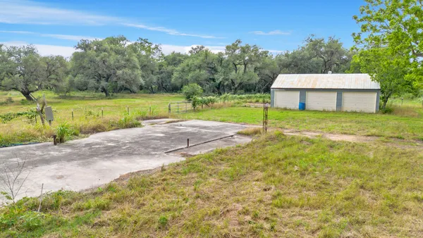 a view of a house with a yard and a swimming pool
