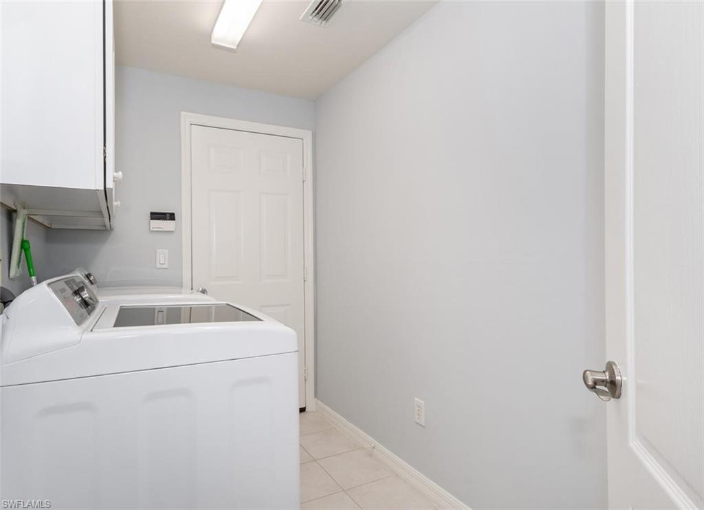8449 Indian Wells Way Naples, FL 34113 - Photo 20 of 35 a bathroom with a sink and a vanity