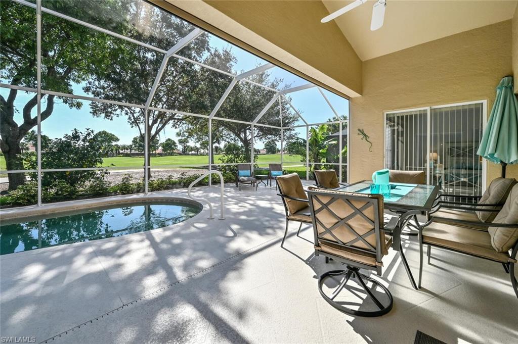 8449 Indian Wells Way Naples, FL 34113 - Photo 21 of 35 a view of yard with patio