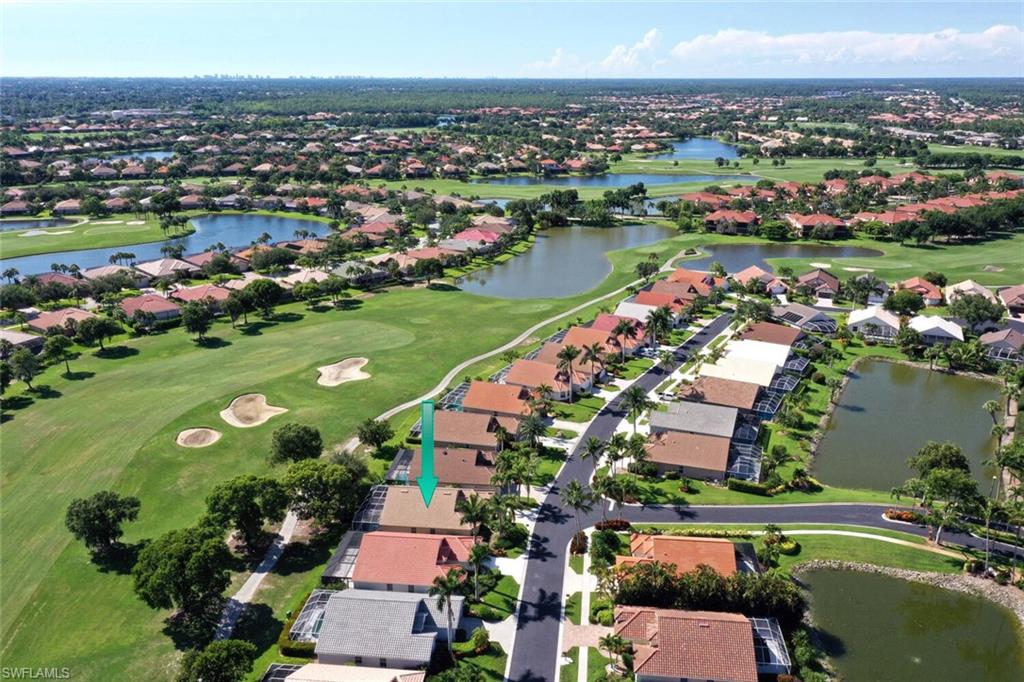 8449 Indian Wells Way Naples, FL 34113 - Photo 24 of 35 an aerial view of a city with lots of residential buildings lake and ocean view