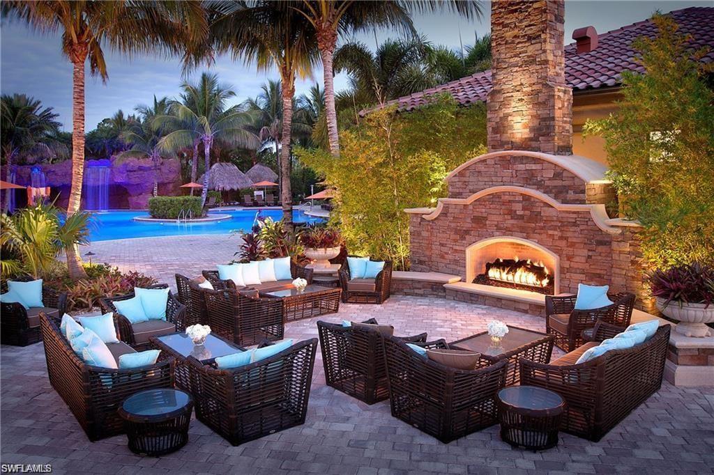 8449 Indian Wells Way Naples, FL 34113 - Photo 28 of 35 a outdoor living space with furniture and a potted plant