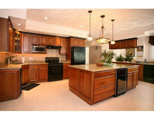 a kitchen with stainless steel appliances granite countertop a stove and a sink