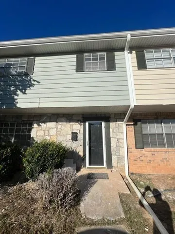 a view of a house with entrance gate