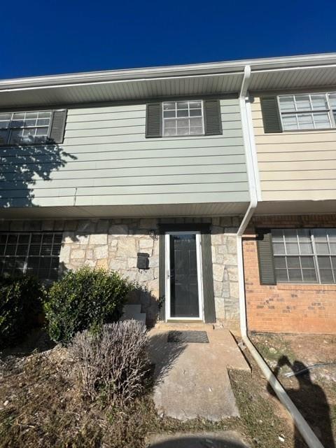 a view of a house with entrance gate