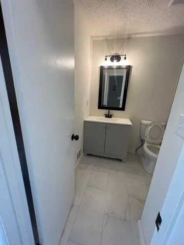 a room with furniture and flat screen tv