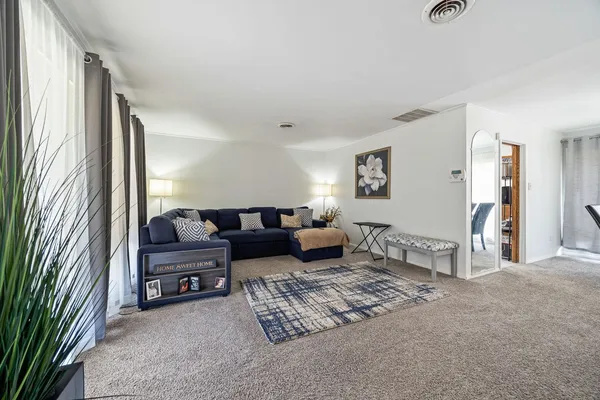 a living room with furniture and a window