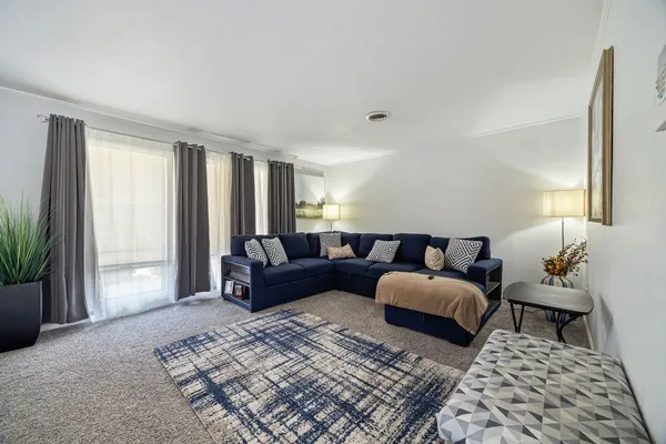 a living room with furniture and a window