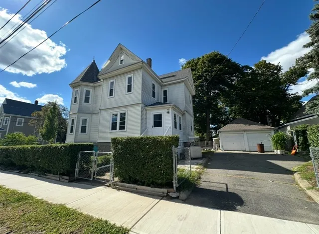 a view of house with yard and outdoor space