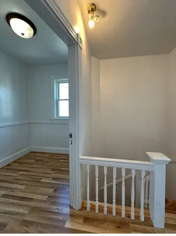 a view of entryway with wooden floor