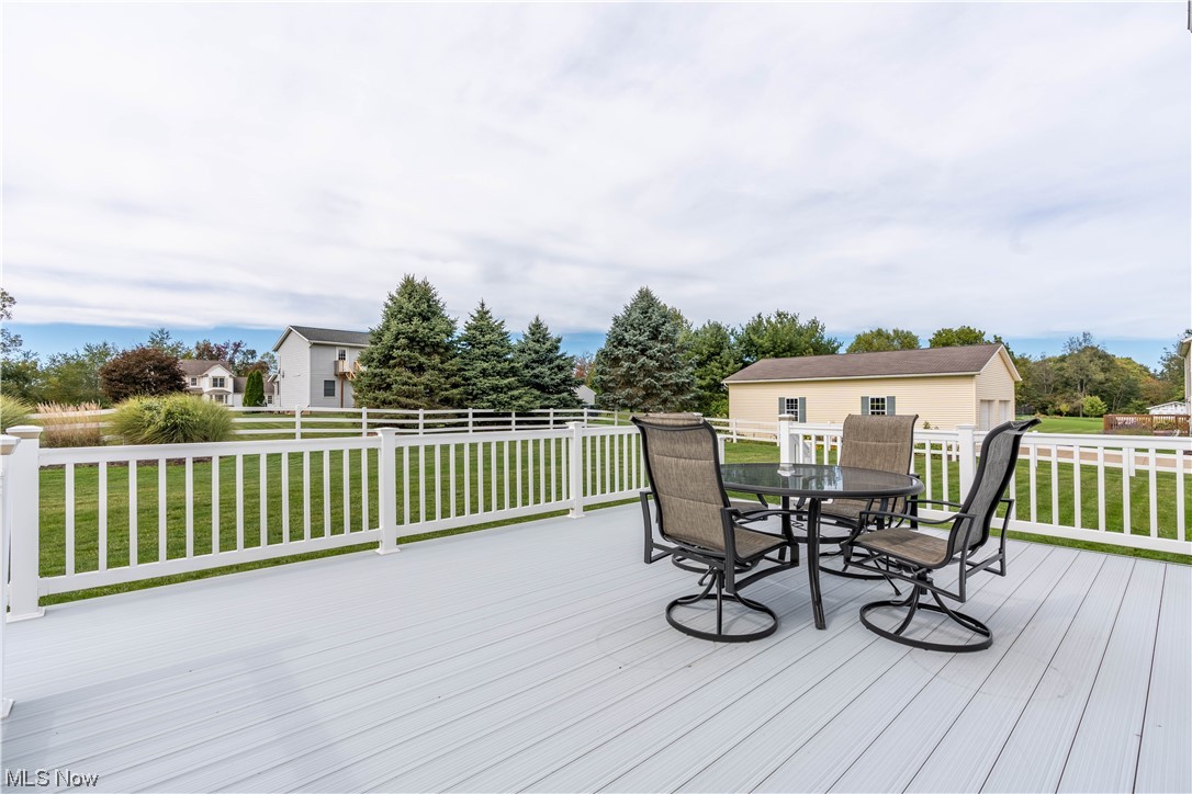 2652 Woodview Road Uniontown, OH 44685 - Photo 9 of 35 Here is a view of the large deck off the kitchen. Perfect for entertaining. The deck walks down to a patio.