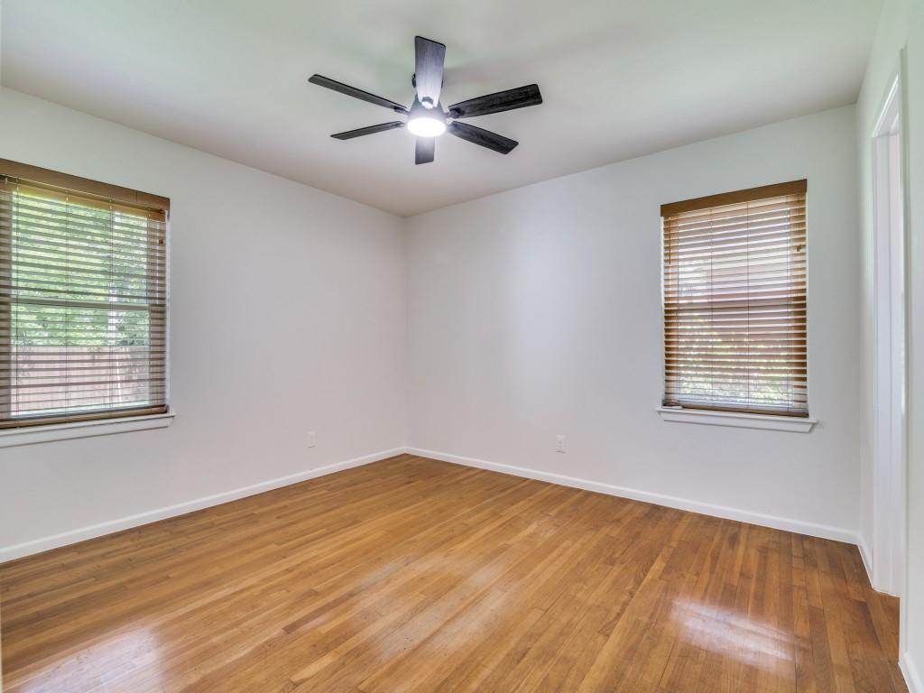 2315 Inadale Avenue Dallas, TX 75228 - Photo 22 of 36 a view of an empty room with wooden floor and a window