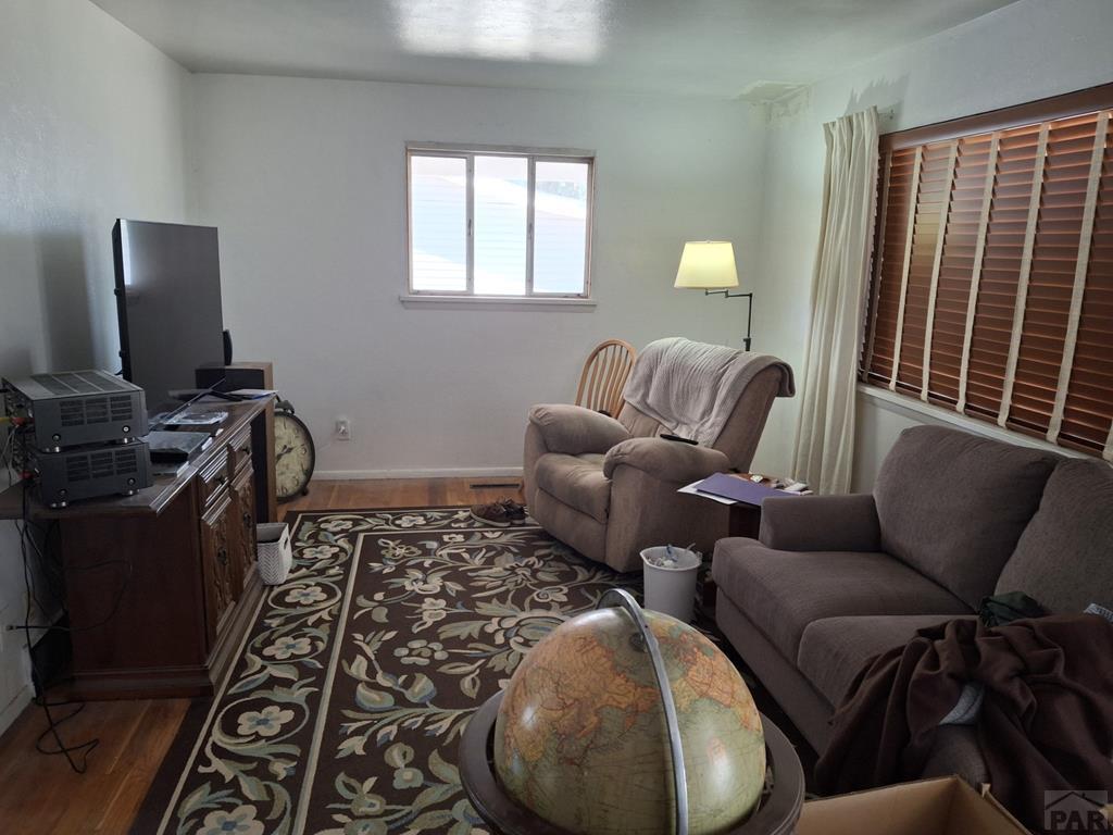 214 3rd Street Fowler, CO 81039 - Photo 3 of 15 a living room with furniture and a window