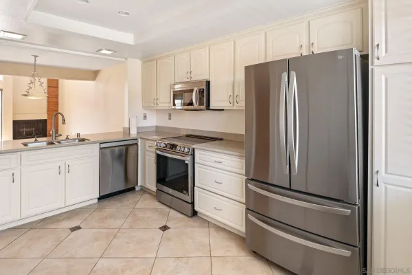 a kitchen with cabinets and window