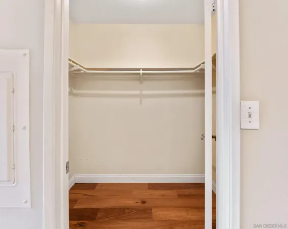 an empty room with wooden floor