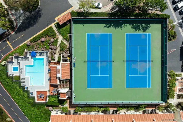 an aerial view of a houses with yard