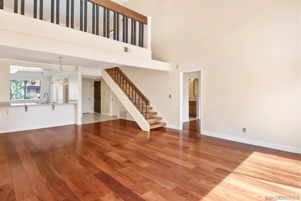 a view of an entryway with wooden floor