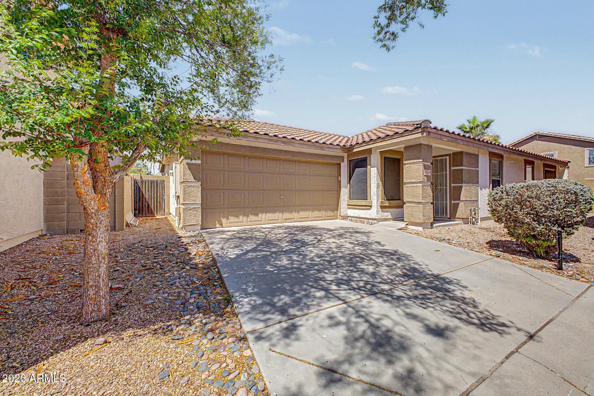 3489 South Bowman Road Apache Junction, AZ 85119 - Photo 1 of 24 a front view of a house with a garden