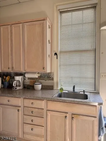 a kitchen with a sink and cabinets