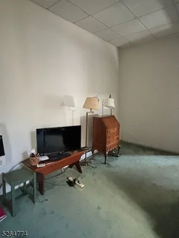 a bedroom with a bed and a table in it
