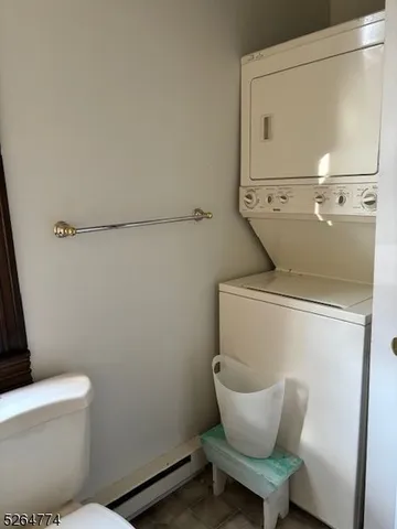 a white toilet sitting next to a bathroom sink