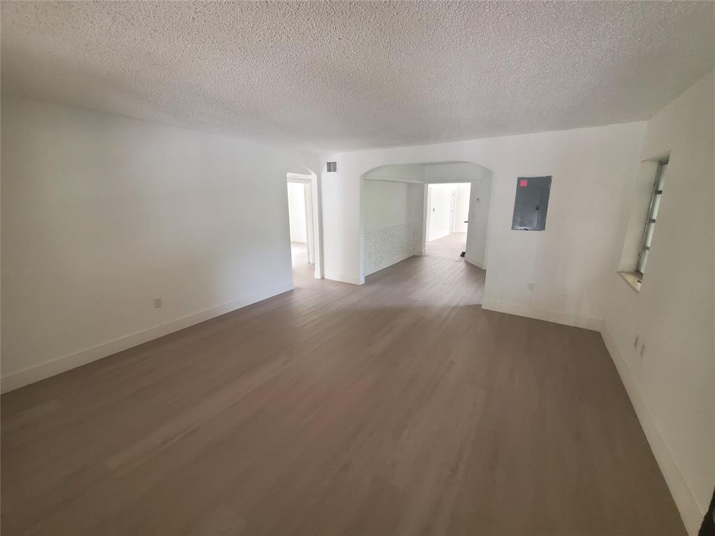 74 Northwest 31st Street, Unit 1 Miami, FL 33127 - Photo 1 of 14 a view of a big room with closet and windows