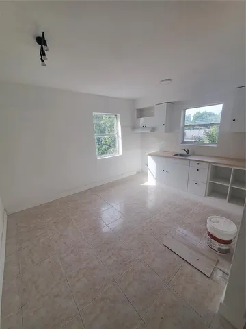 an empty room with a washer and dryer