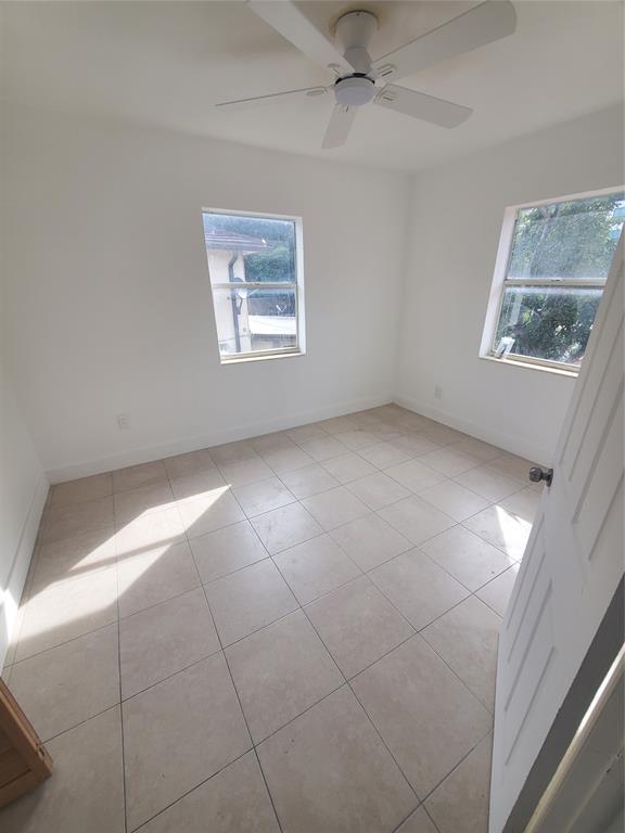 74 Northwest 31st Street, Unit 1 Miami, FL 33127 - Photo 13 of 14 a view of an empty room with a window