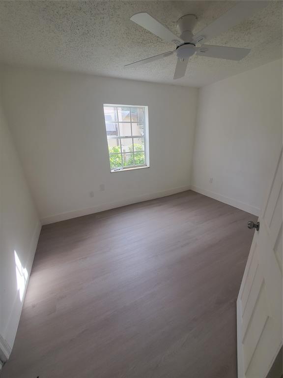 74 Northwest 31st Street, Unit 1 Miami, FL 33127 - Photo 8 of 14 an empty room with a window