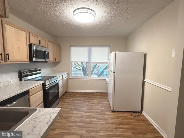 a bathroom with a sink toilet and vanity