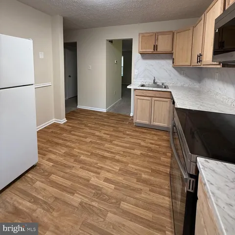a view of an empty room and a window