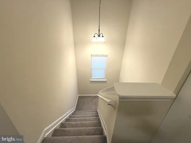 a bathroom with a sink mirror and toilet