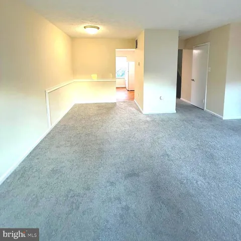a kitchen with granite countertop a sink and a stove top oven