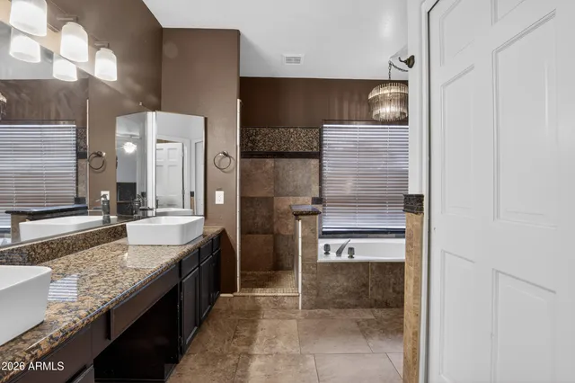 a bedroom with a bed and a desk