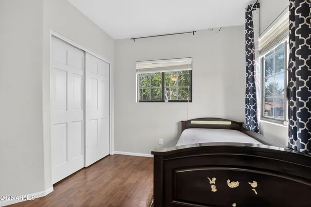 a view of room with window and wooden floor