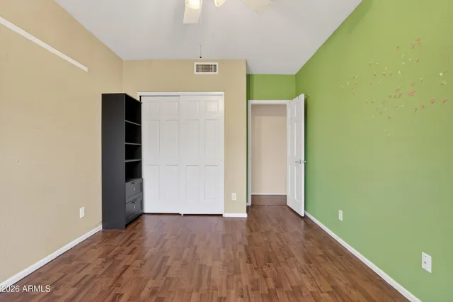 a bathroom with a toilet and a shower curtain