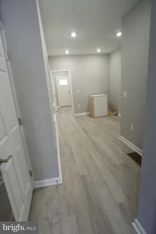 a view of a big room with closet and wooden floor