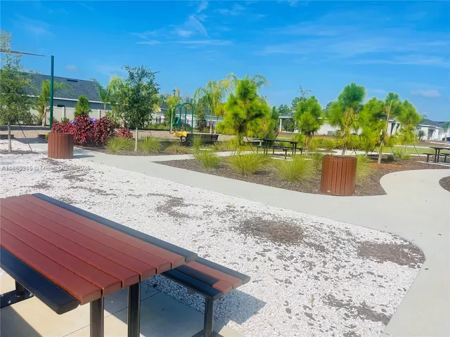 a front view of a building with garden