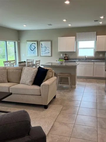 a kitchen with a cabinets a sink and a stove