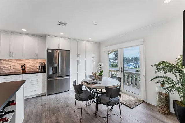 a spacious bathroom with a granite countertop tub sink shower and mirror