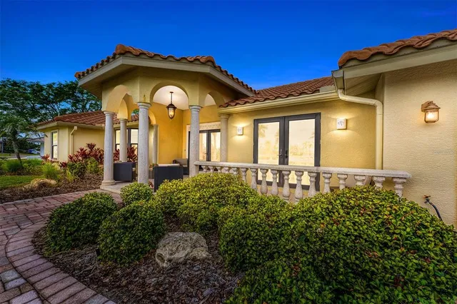 a view of a dining room with furniture a chandelier and wooden floor